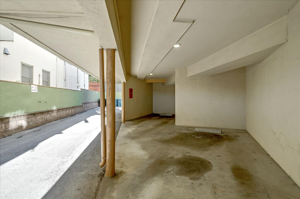 a large empty room in a building with a street