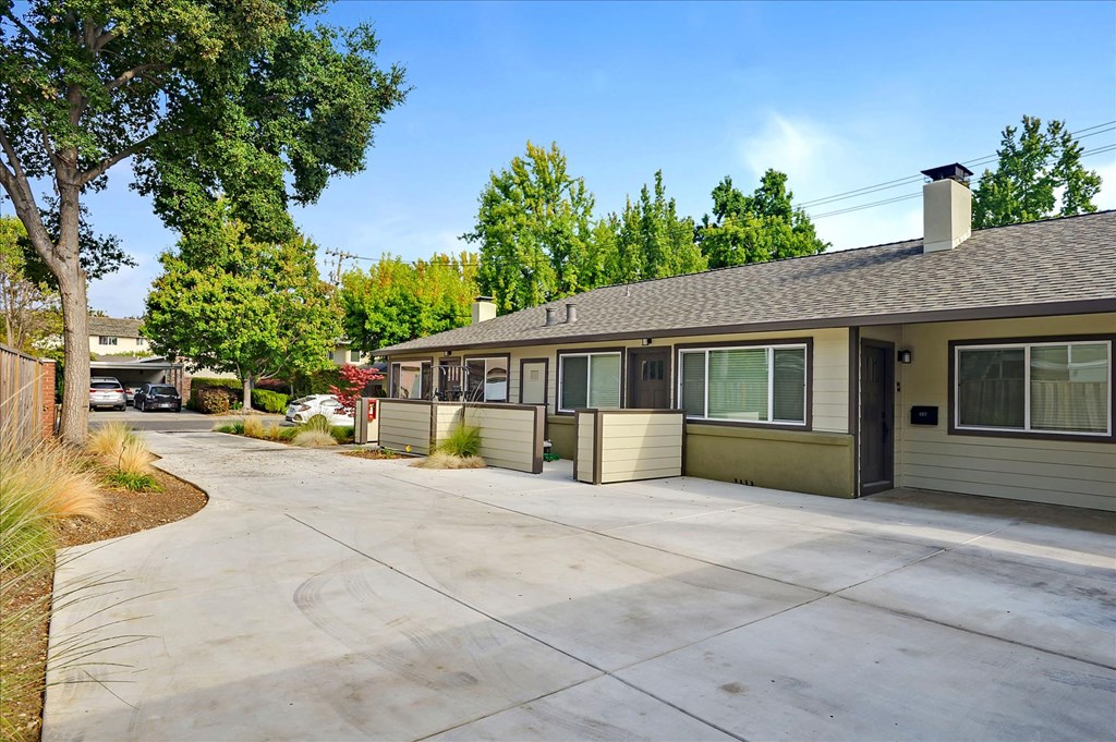a house with a driveway and a parking lot