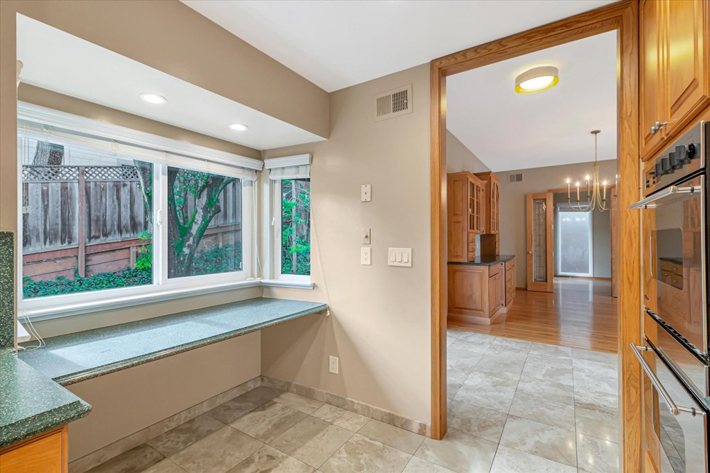 a kitchen with a large window and a counter top