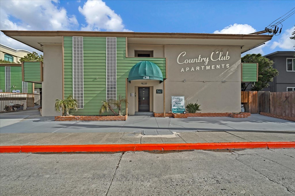 The front of the Country Club Apartments building