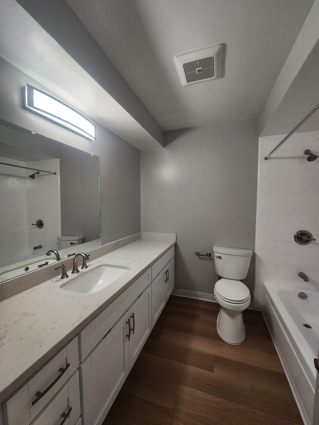 an empty bathroom with a toilet and a sink