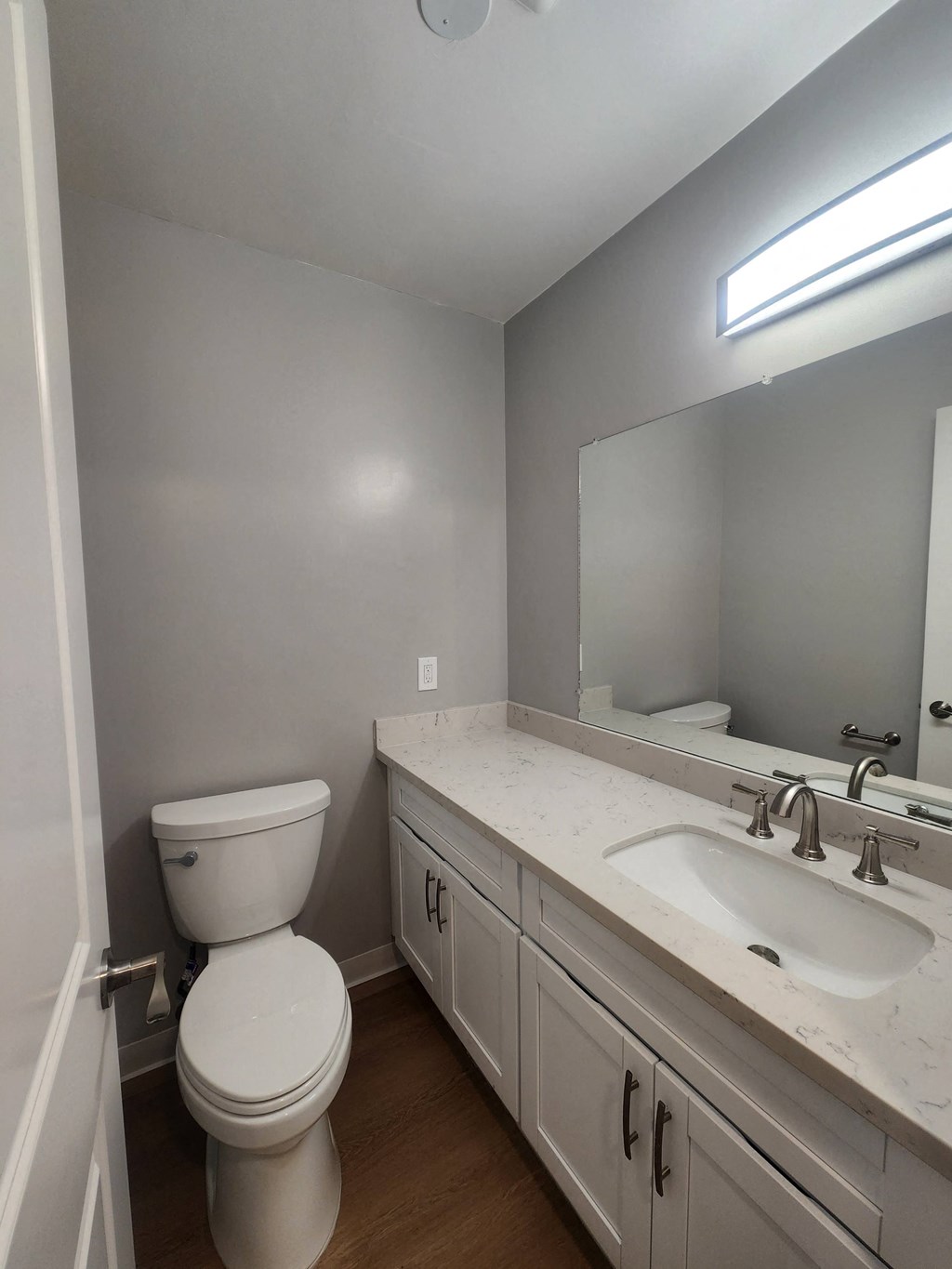 an empty bathroom with a toilet and a sink