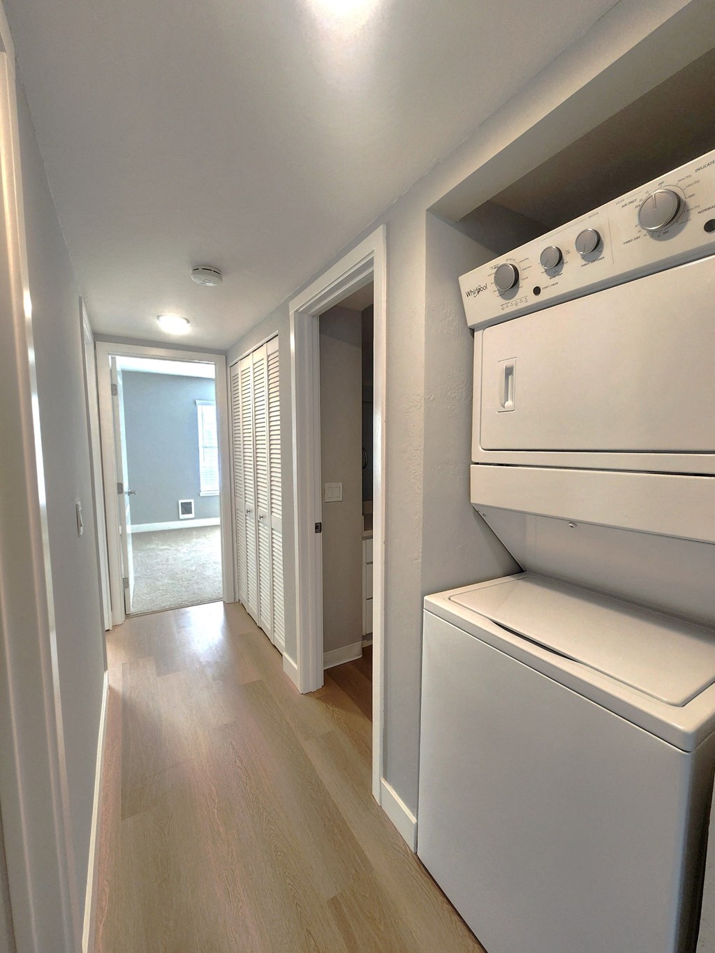 an empty laundry room with a washer and dryer