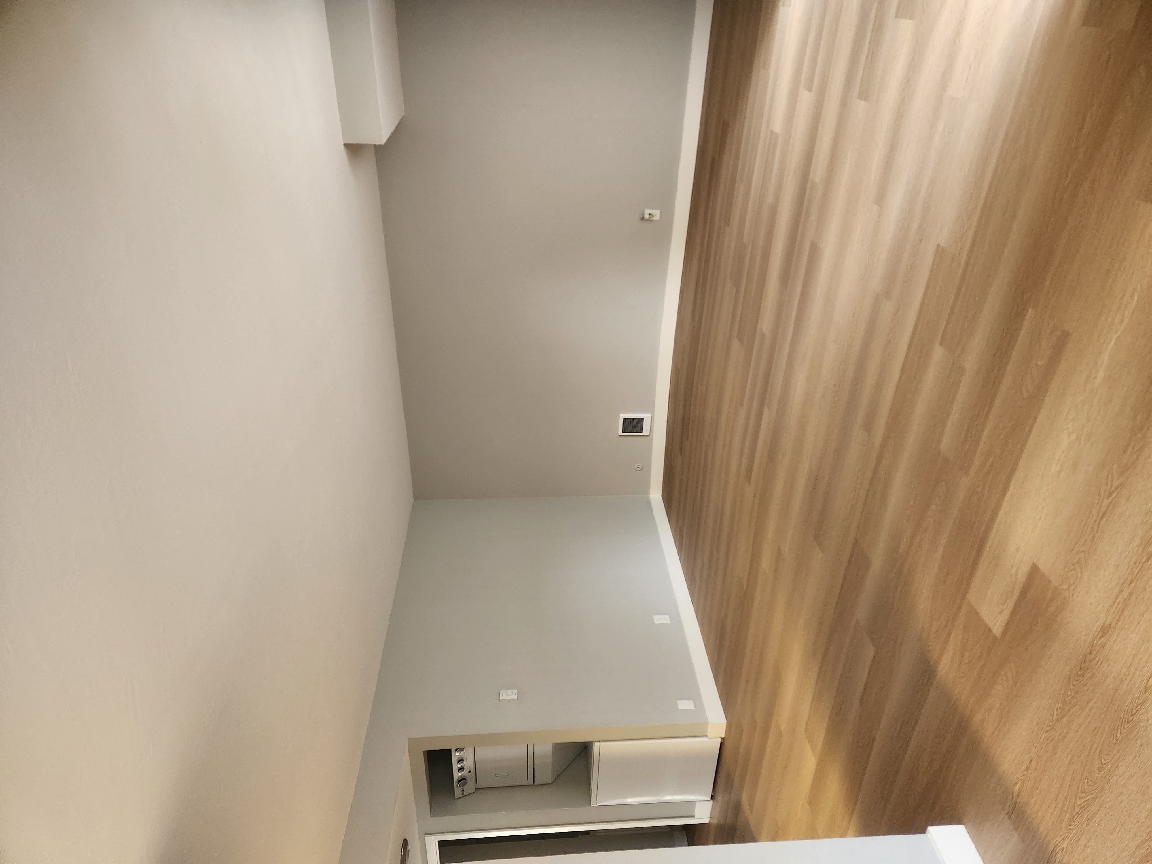 an overhead view of a kitchen with a white counter and a wood floor