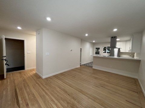 A kitchen area with a stove and a refrigerator.