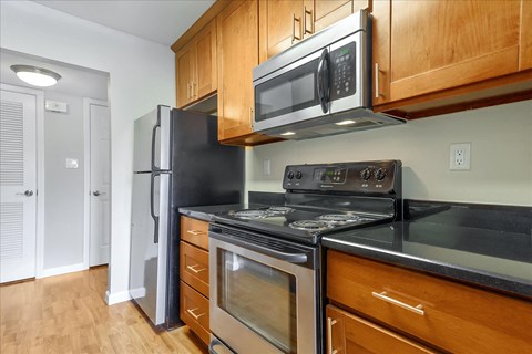 a kitchen with a stove microwave and refrigerator