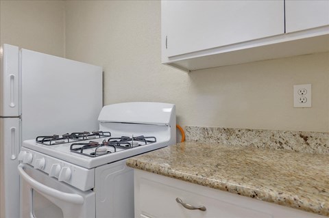a kitchen with a stove and a counter top