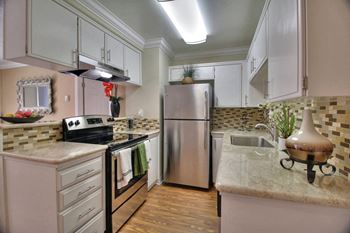 Modern Kitchen with Efficient Appliances at Casa Alberta Apartments, California