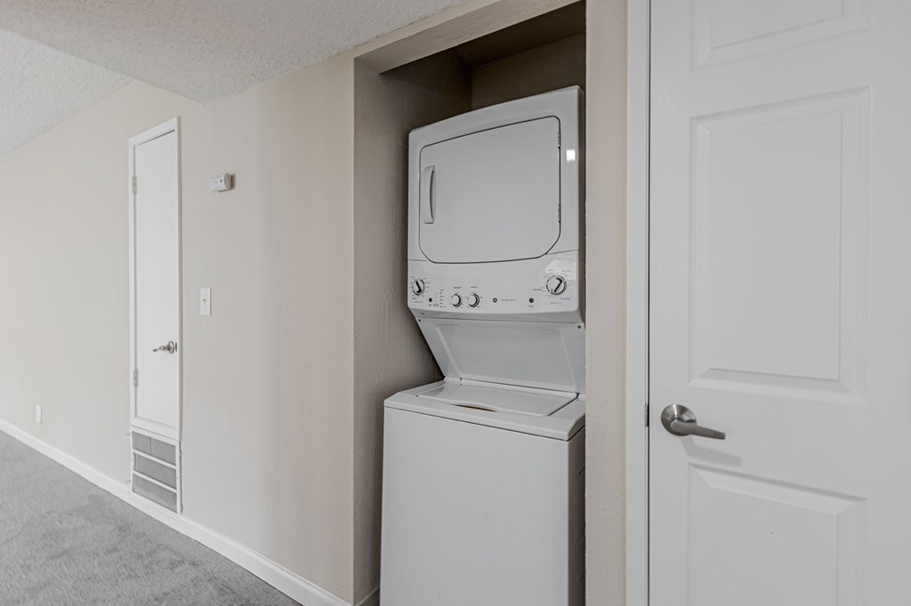 A white dishwasher is built into a wall in a kitchen.