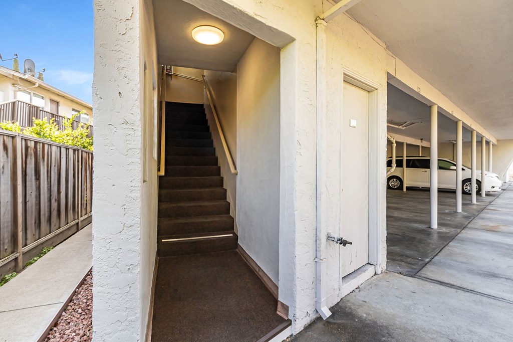 A car is parked in the garage of a house.