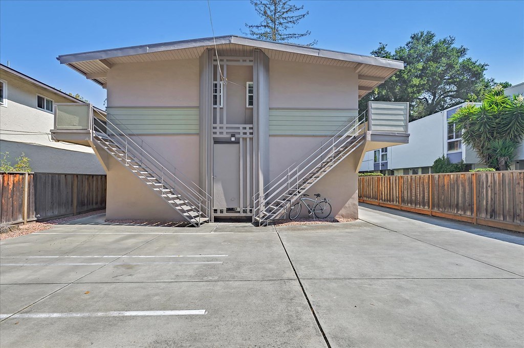 a small building with a staircase on the side of it