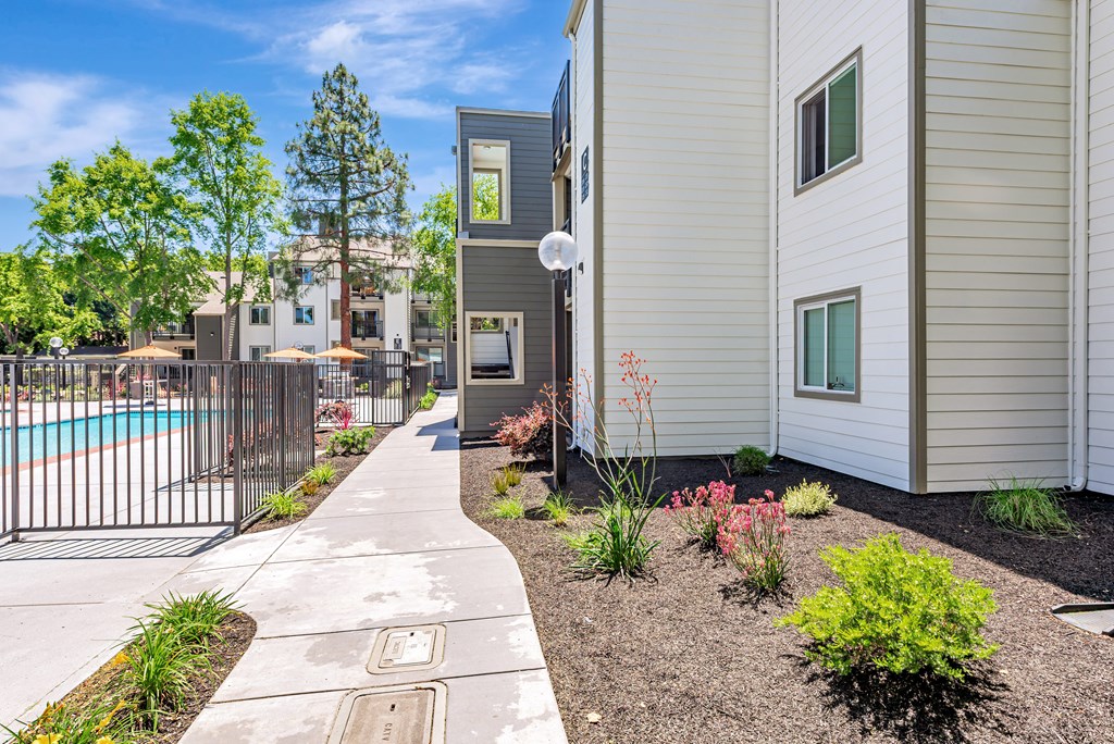 A residential area with a pool and a fence.