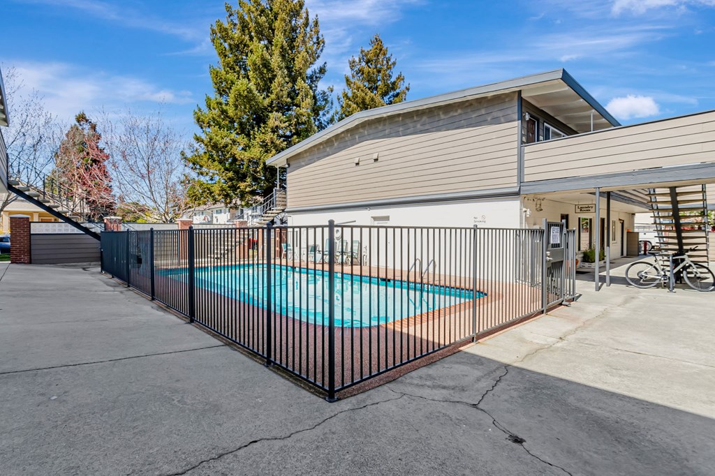 A house with a pool in the backyard.