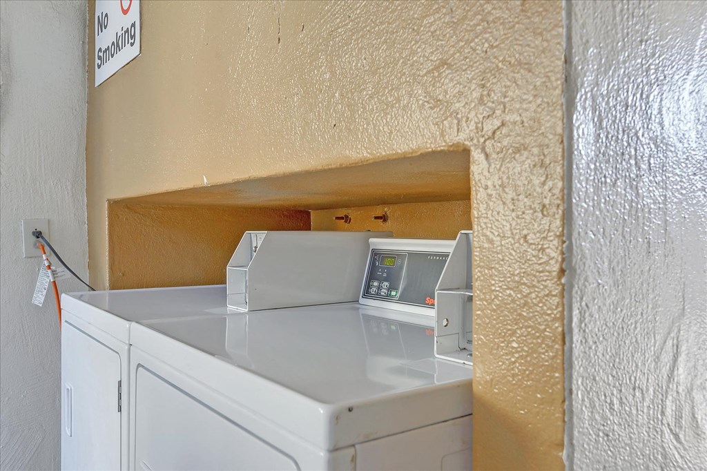 a laundry room with a washer and dryer