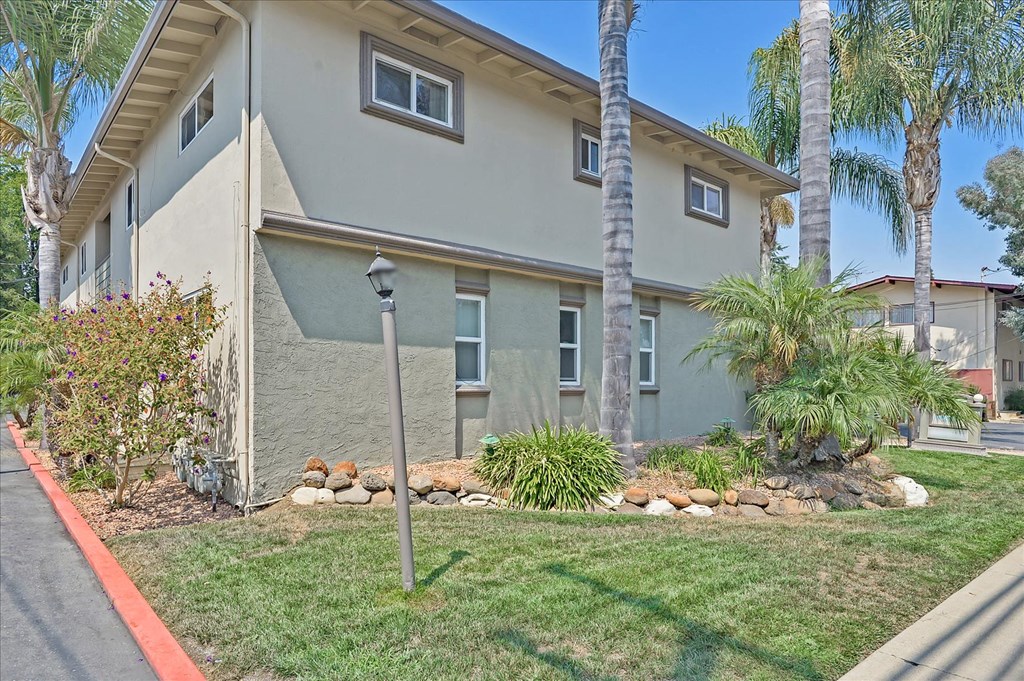 a house with palm trees in front of it