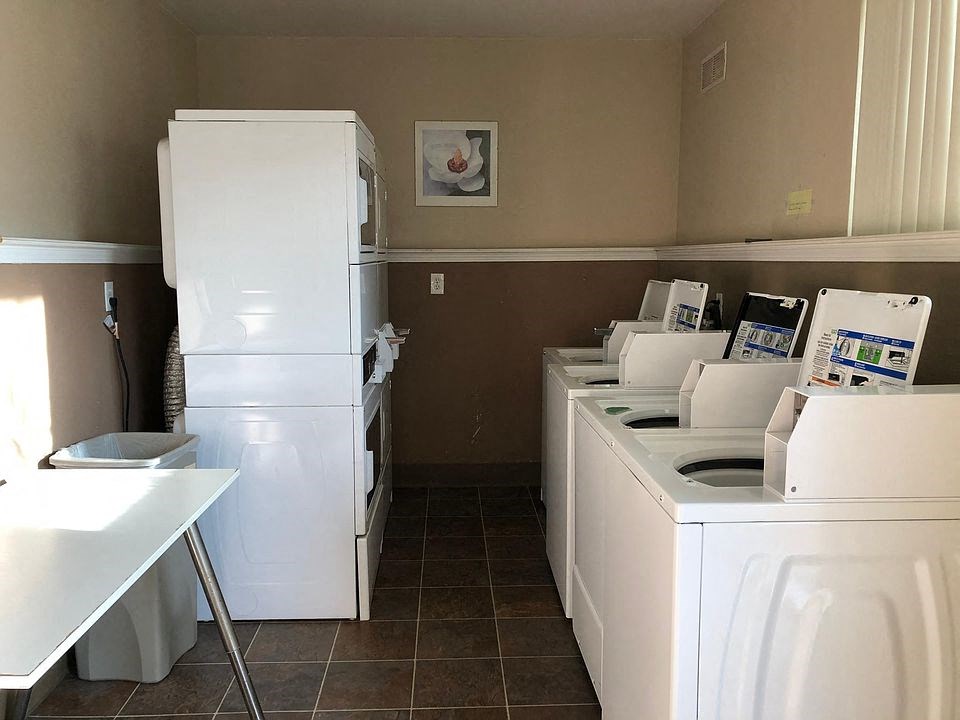 a kitchen with a bunch of white appliances in it