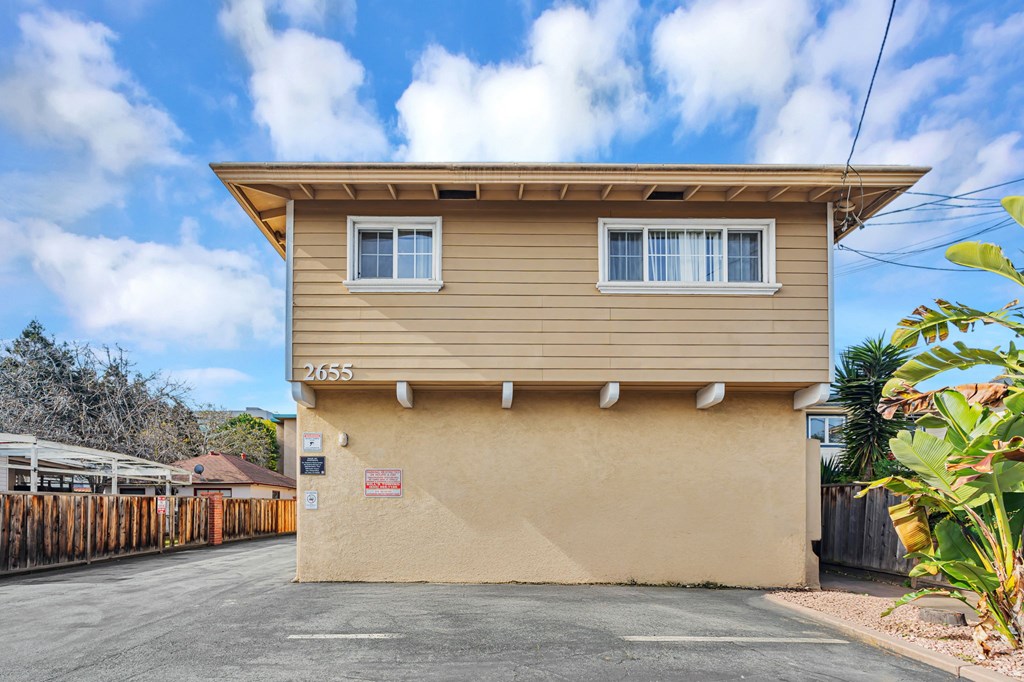 A two-story building with a garage is numbered 2655.