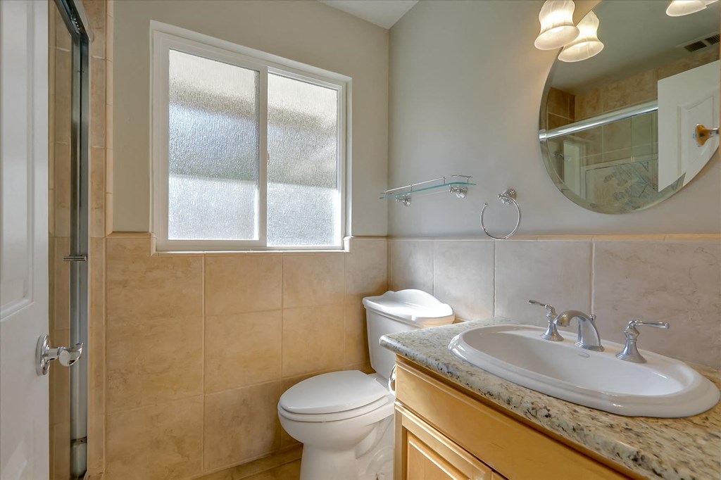 a bathroom with a sink toilet and a shower