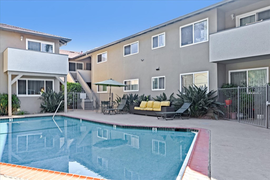 a swimming pool in front of a building