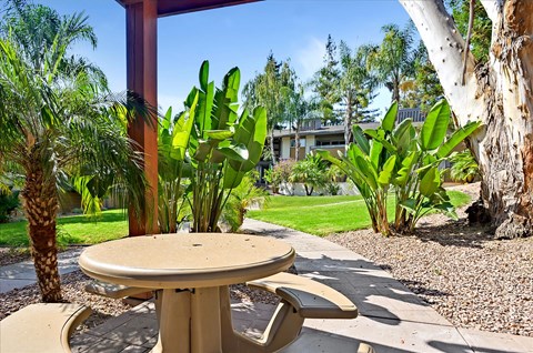A table and chairs set up outside on a patio.