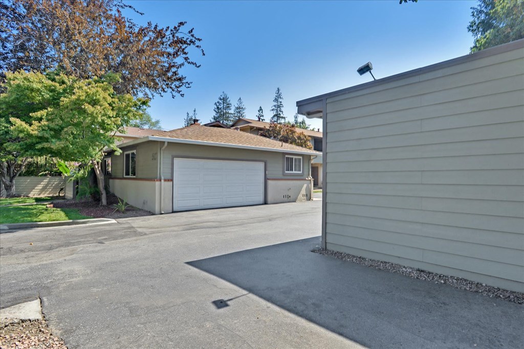 A residential house with a garage and a driveway.