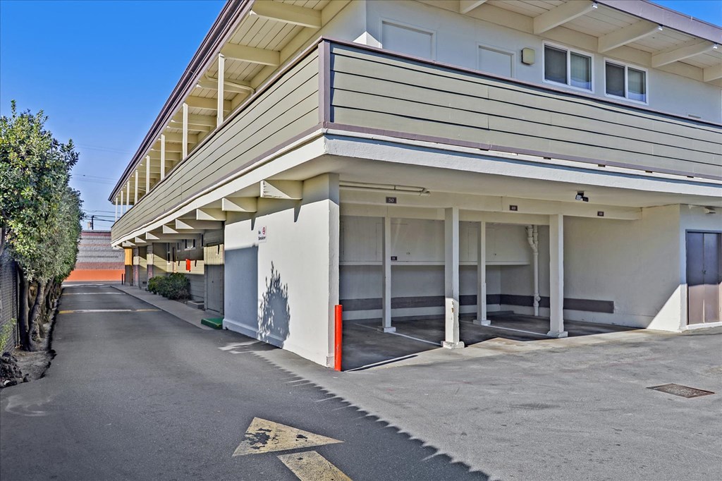 a building with an empty parking lot in front of it