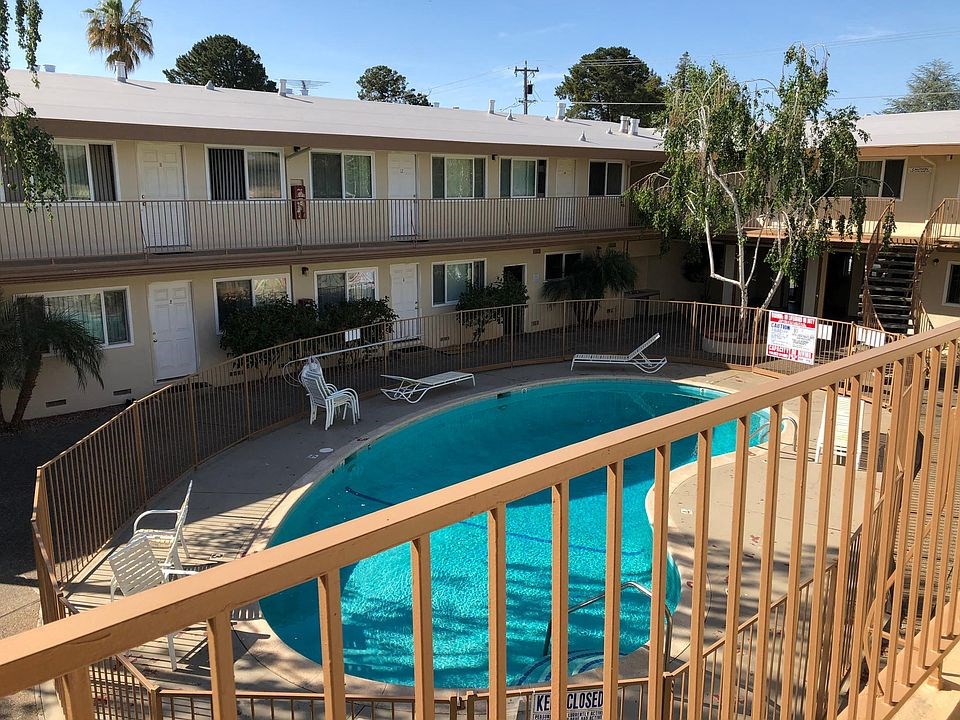 a view of a swimming pool from a balcony