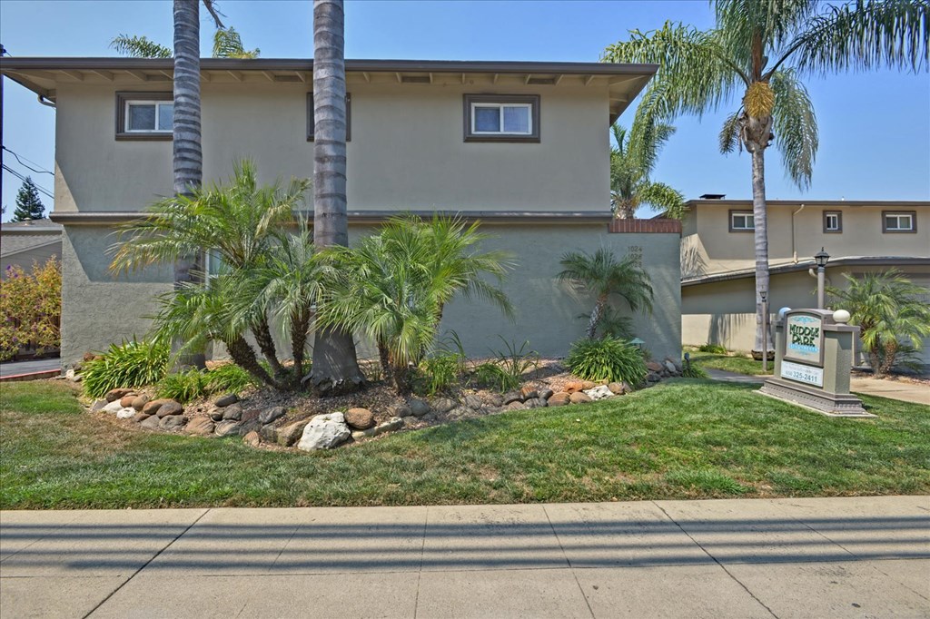 a house with palm trees in front of it
