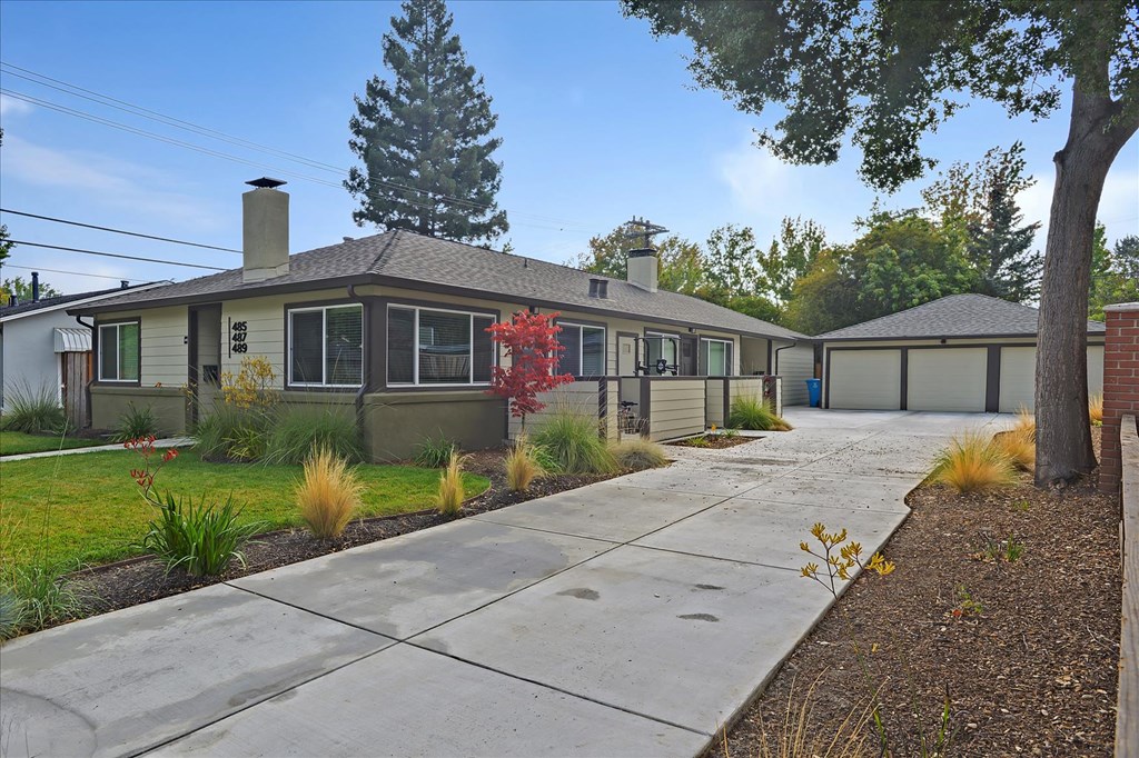 a house with a sidewalk in front of it