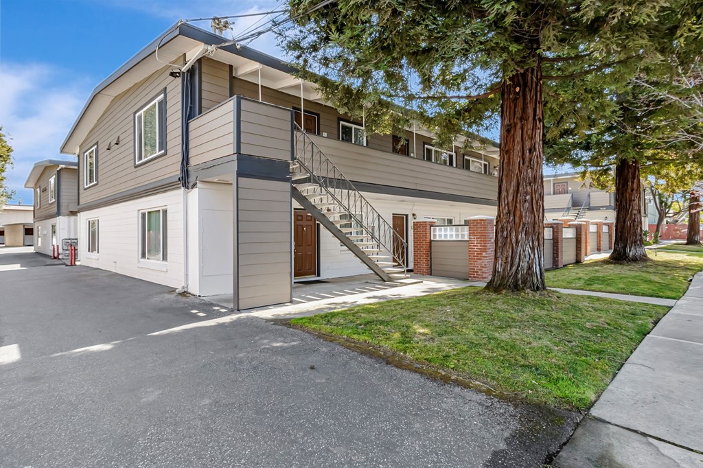 A modern two-story house with a garage and a driveway.
