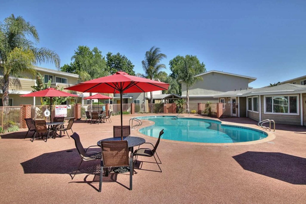 Swimming Pool Area With Shaded Chairs at Ranchero Plaza, San Jose, CA