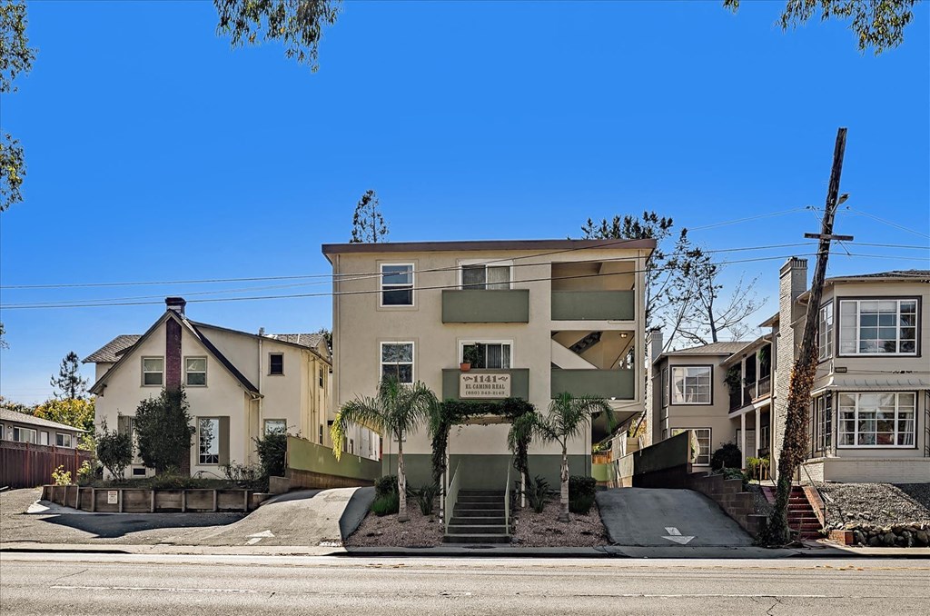 a view of an apartment building from the street