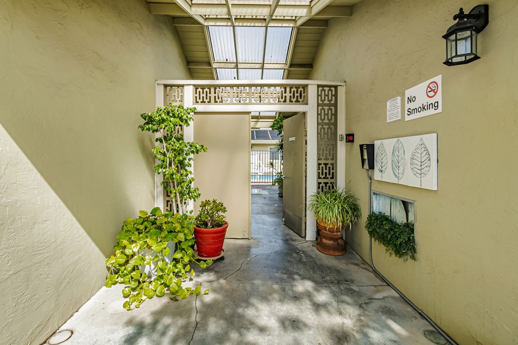 A hallway with a no smoking sign on the wall.