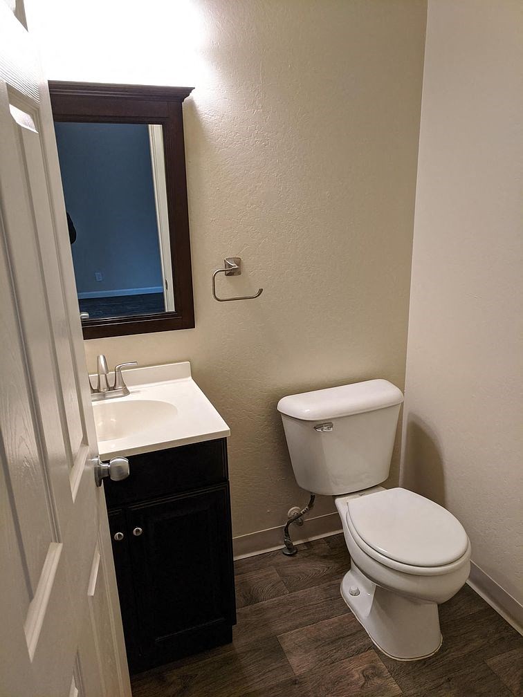 a bathroom with a toilet and a sink