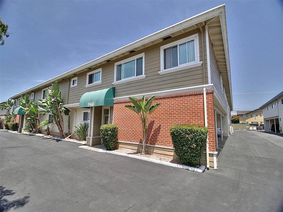 a brick building with a green awning