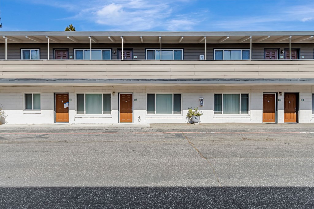 A building with a row of windows and doors.