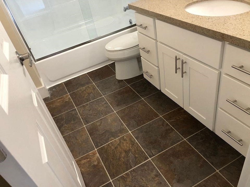 a bathroom with a toilet and a sink