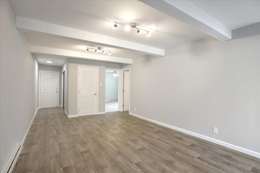 A room with a light grey floor and white walls.