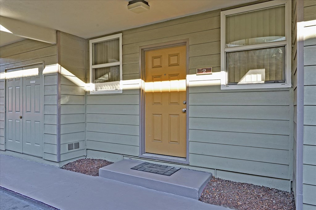 a front door of a house with a porch