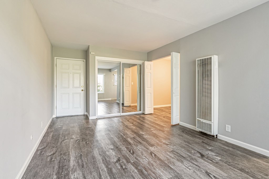 A room with a grey floor and white walls.