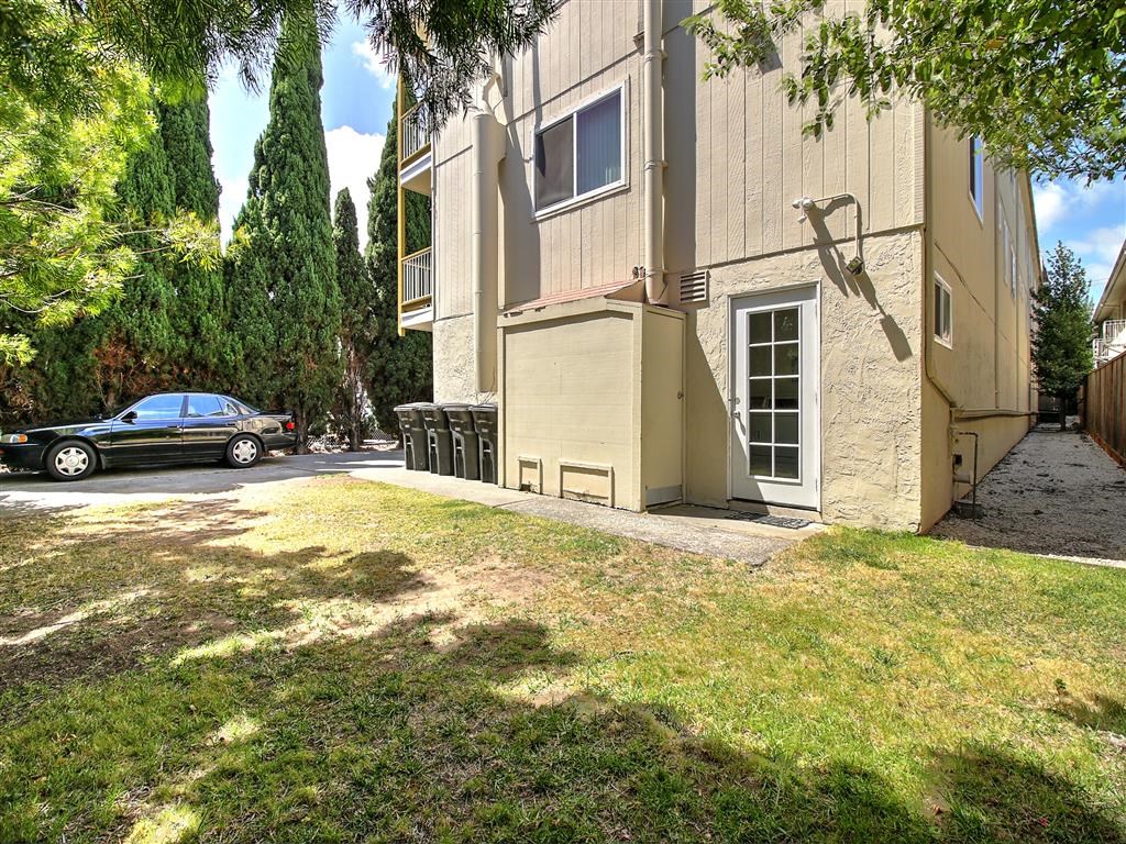 a car parked in front of an apartment building