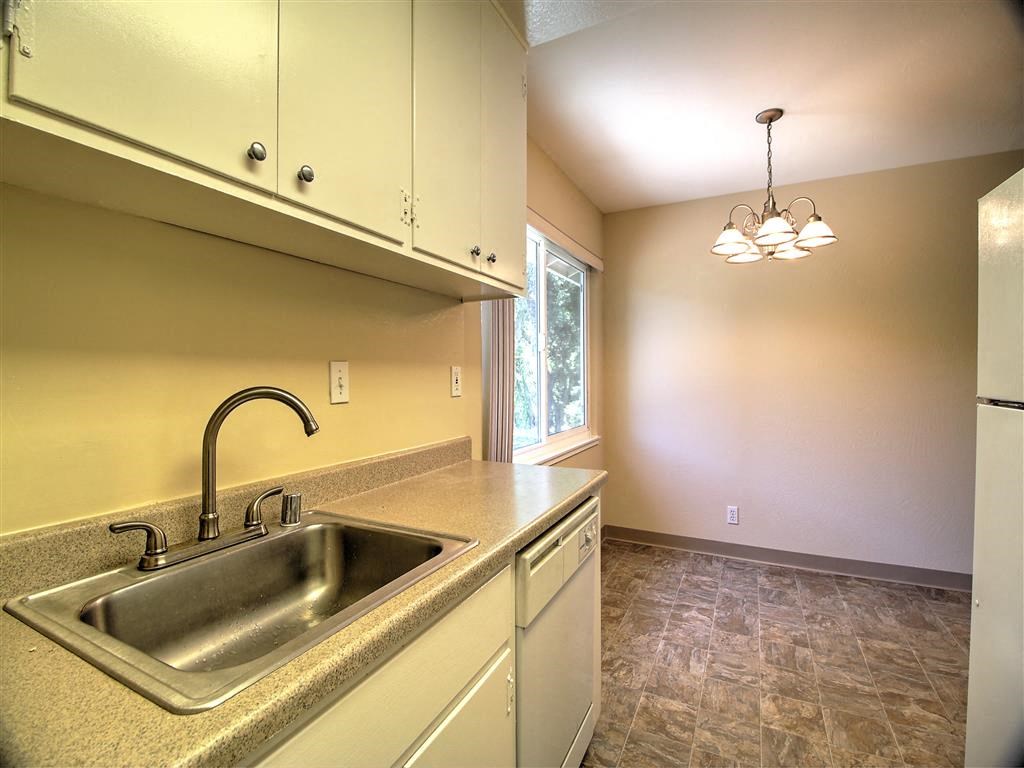 a kitchen with a sink and a window