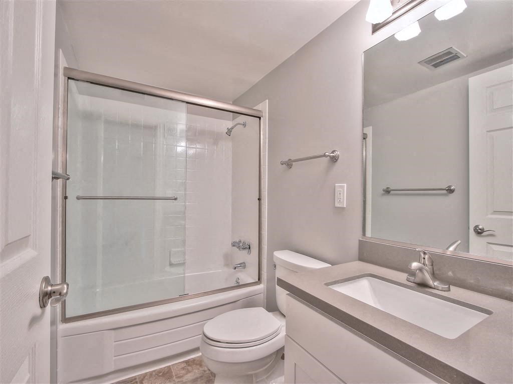 a bathroom with a sink toilet and a shower