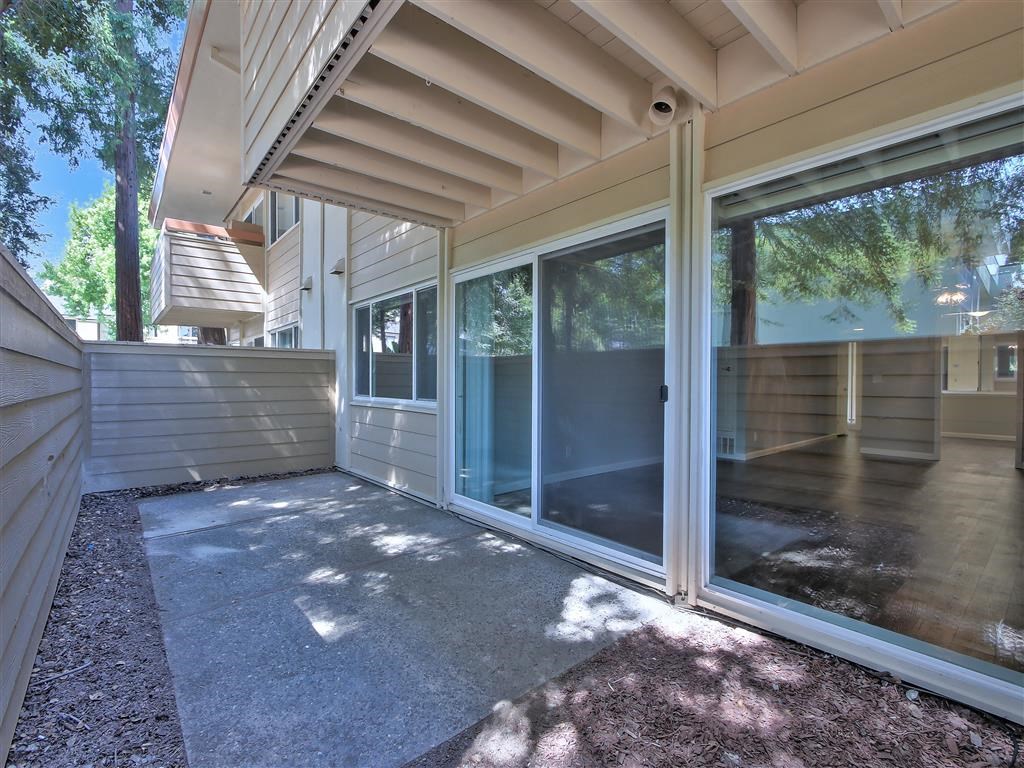 a patio with sliding glass doors in a house