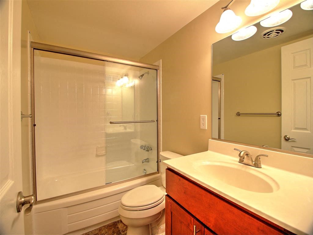 a bathroom with a sink toilet and a shower