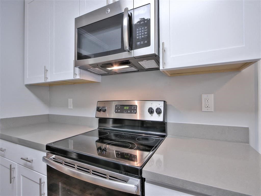 a kitchen with a stove and a microwave