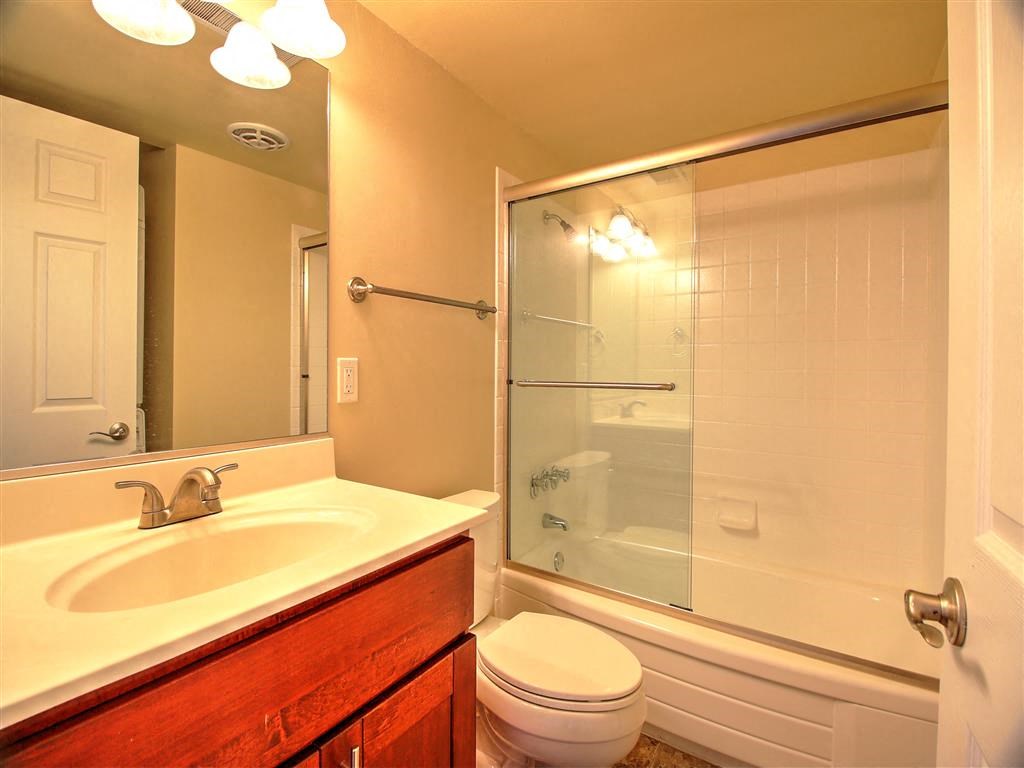 a bathroom with a sink toilet and a shower
