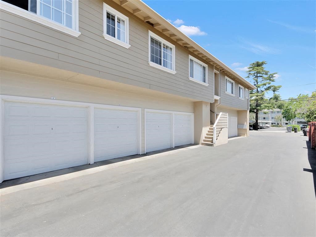 a white garage door on the side of a house