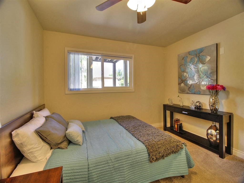 large bedroom with ceiling fan and window at The Arbors at Mountain View, California