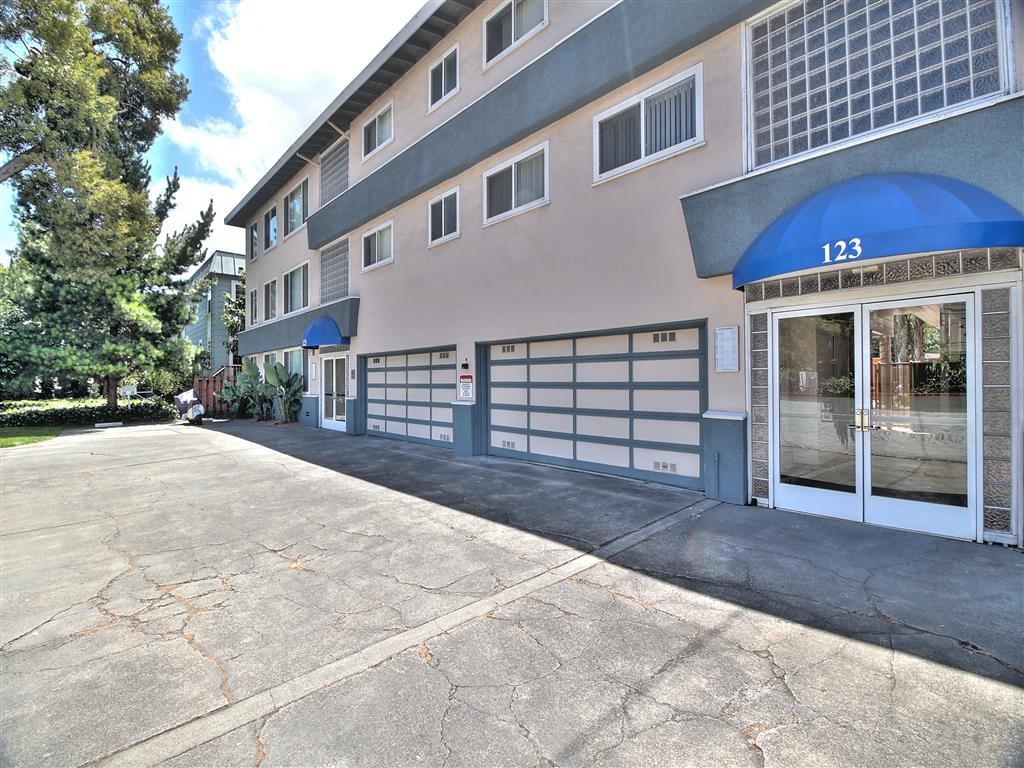 the entrance to a building with a blue and white garage door